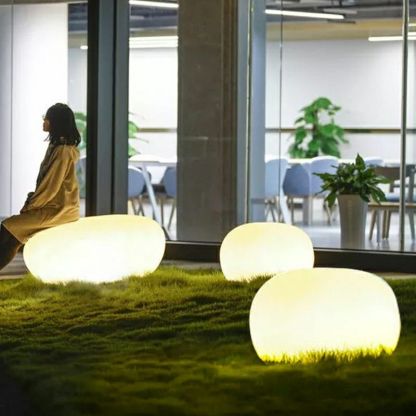 Las Sola Pena stone outdoor lights on lawn Pena Modern Stone Shaped Rechargeable Outdoor Light