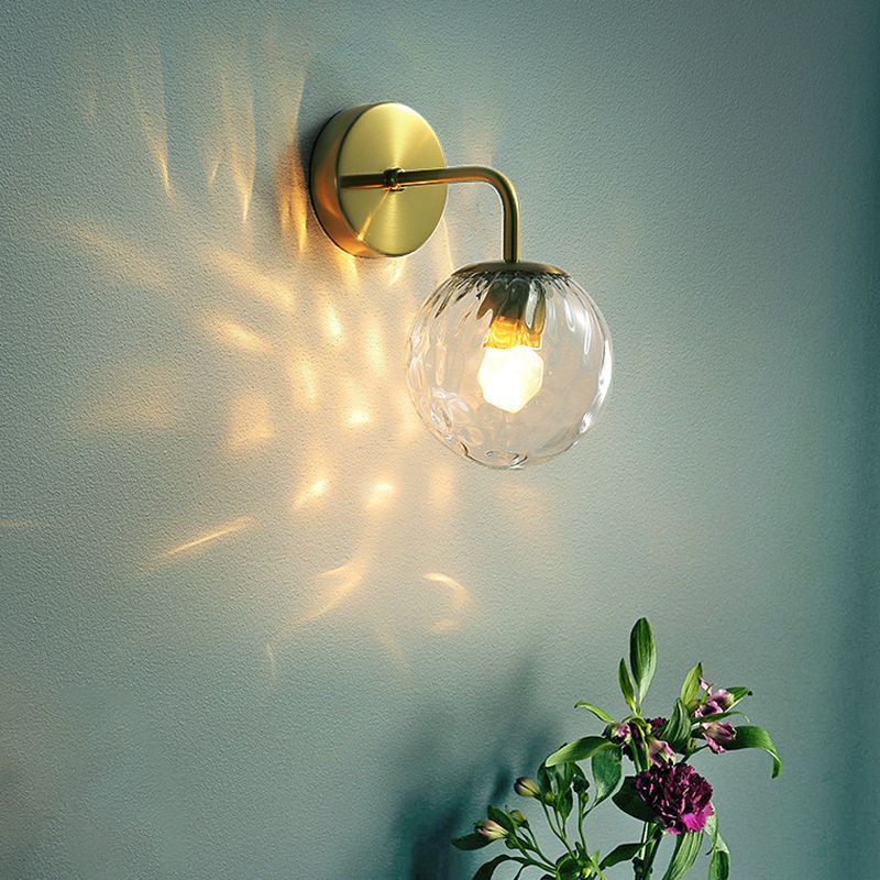 Valentina Vintage Bubble Wall Lamp illuminating a room with gold finish
