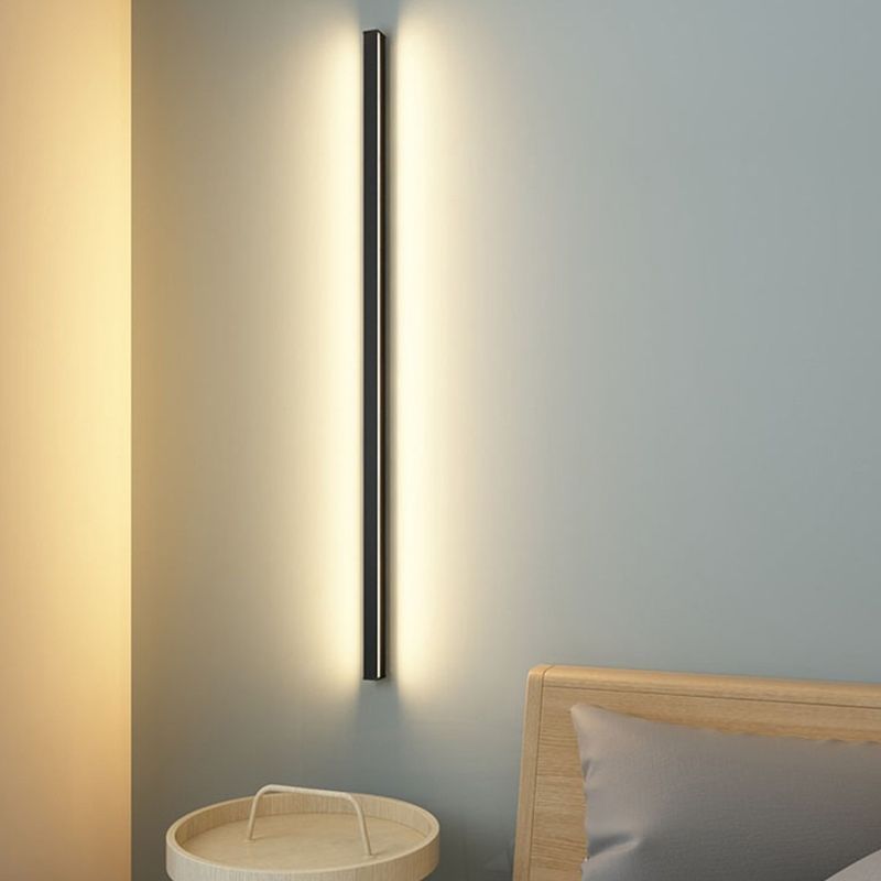 Edge Minimalist Wall Lamp by Las Sola in modern bedroom setting.