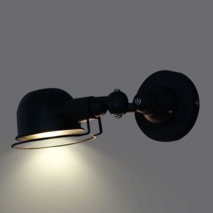 Black Brady metal wall lamp with adjustable arm.