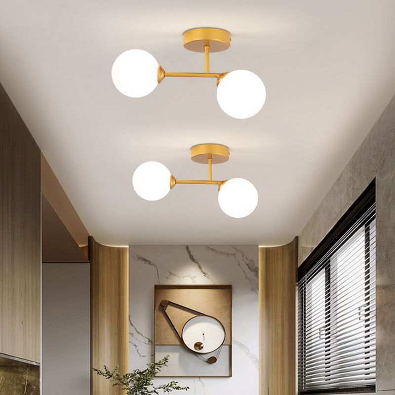 Gold Valentina ceiling light fixture in a modern living room