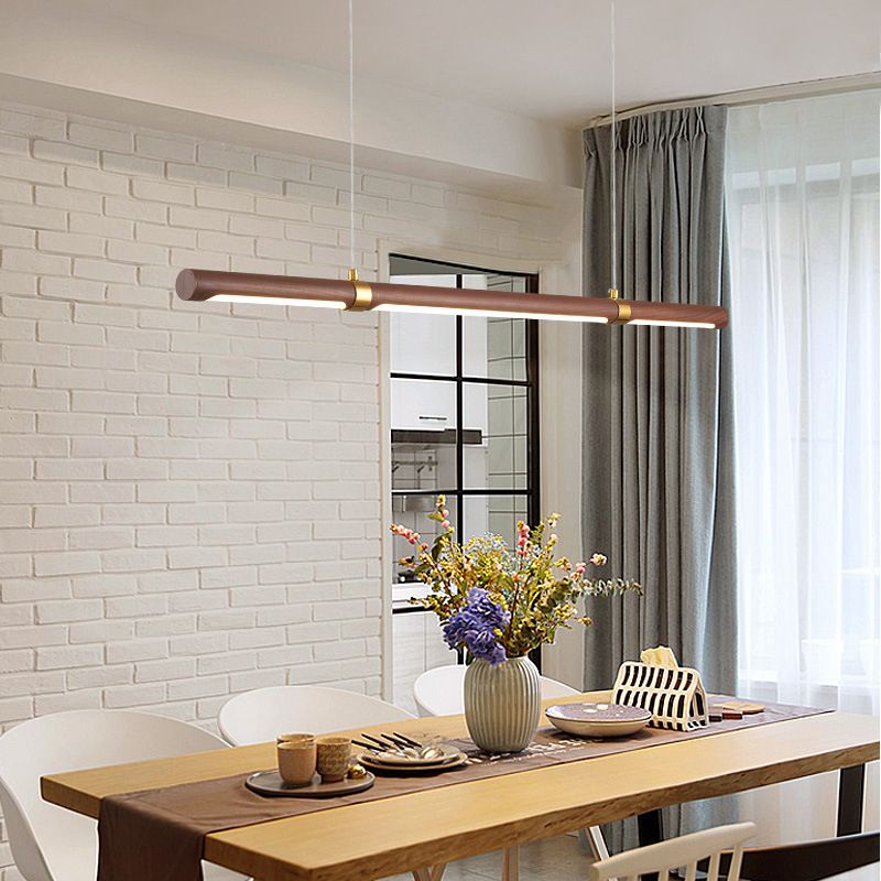 Modern minimalist pendant light above dining table