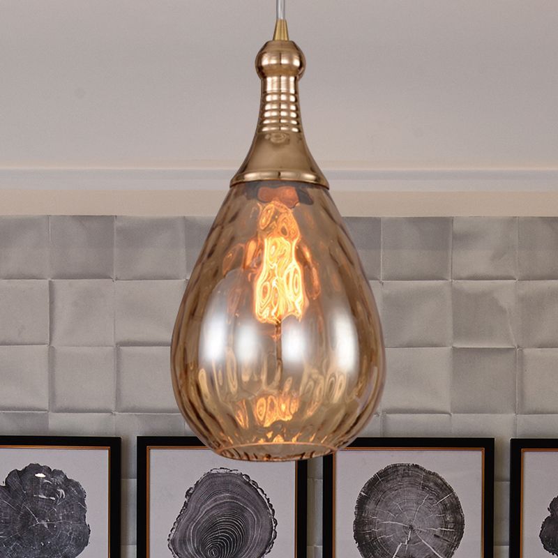 Brass teardrop pendant light. Las Sola artistic lighting solution.