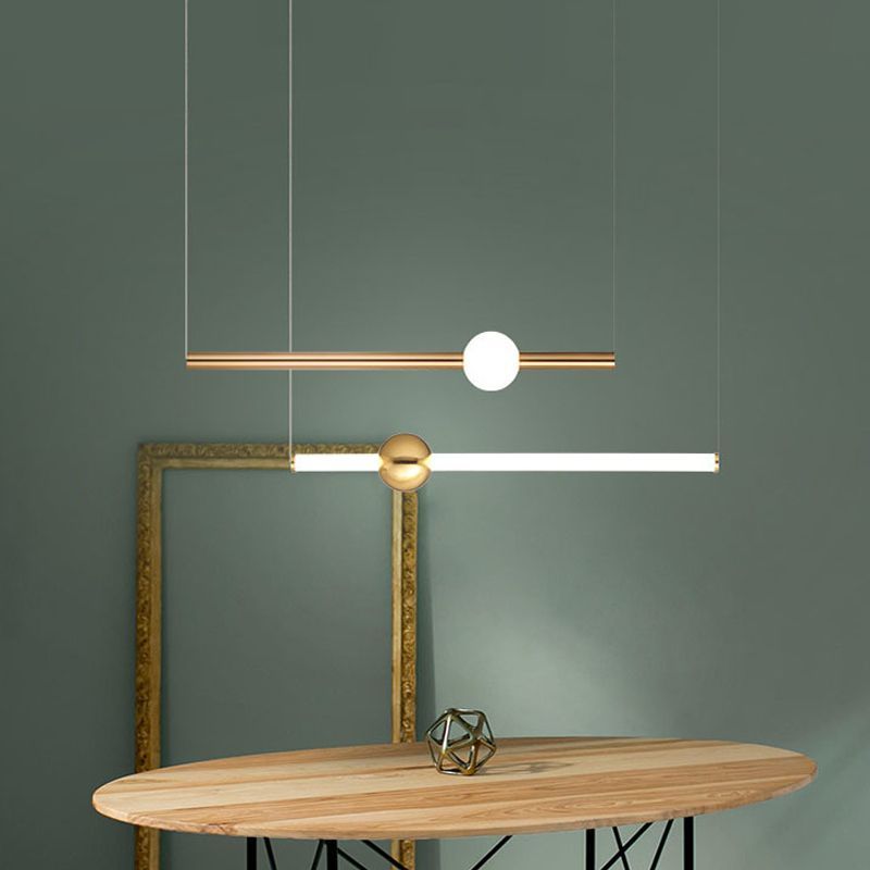 Modern gold pendant lights in a living room setting