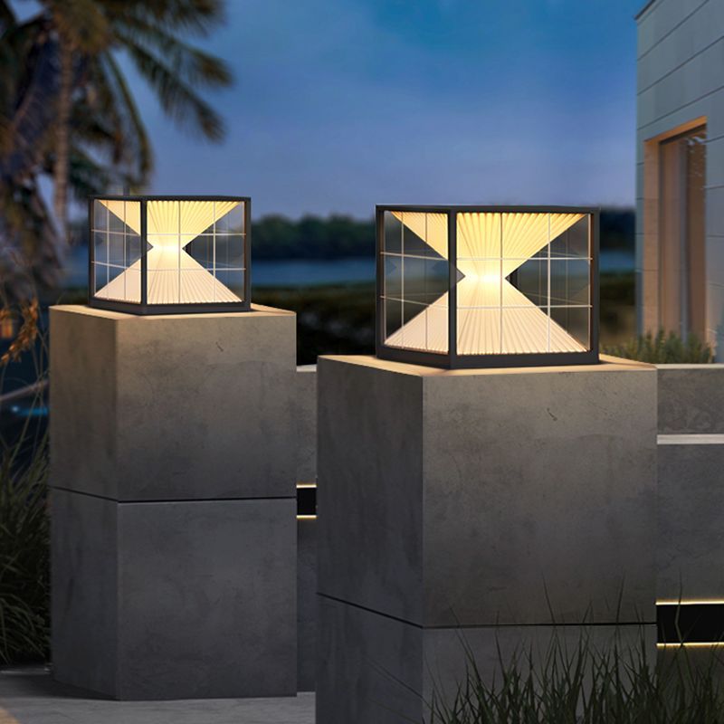 Outdoor Pyramid Pillar Lights illuminating a garden at dusk