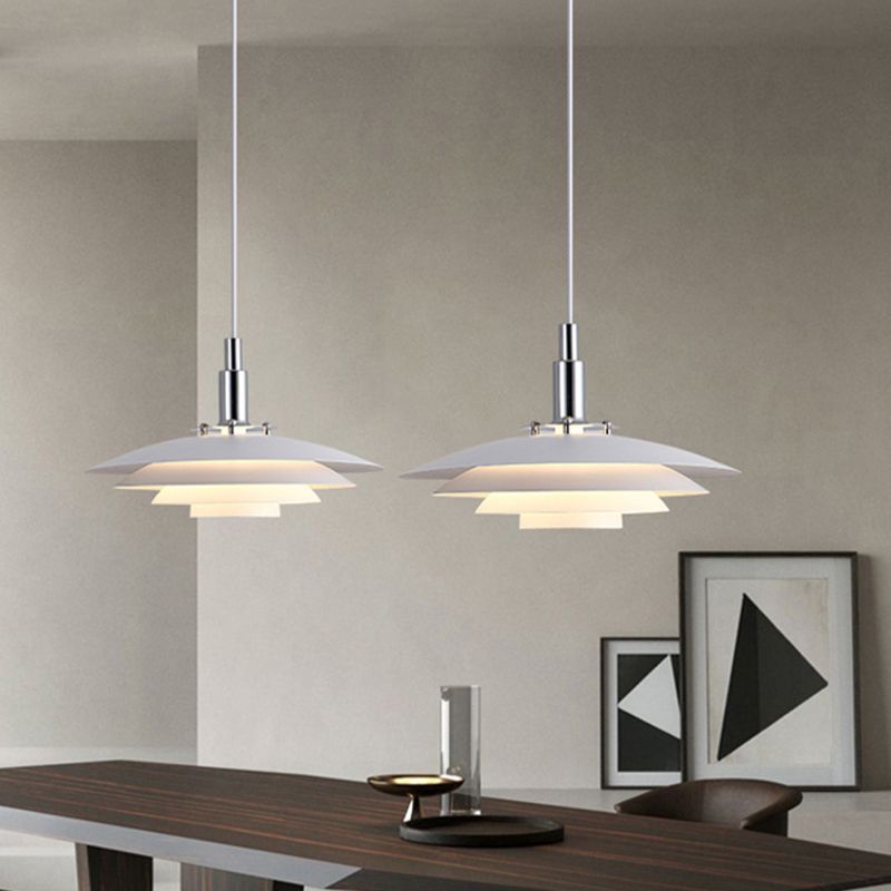 White modern pendant lights over dining table