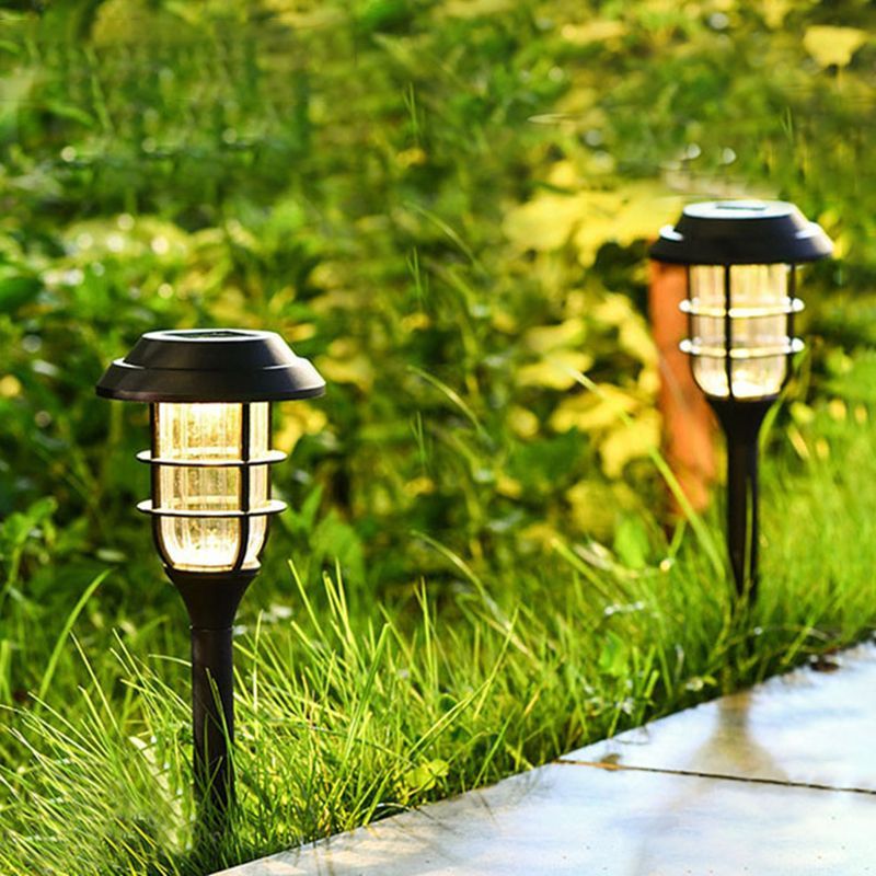 Pena Modern Bollard Lights illuminating a garden