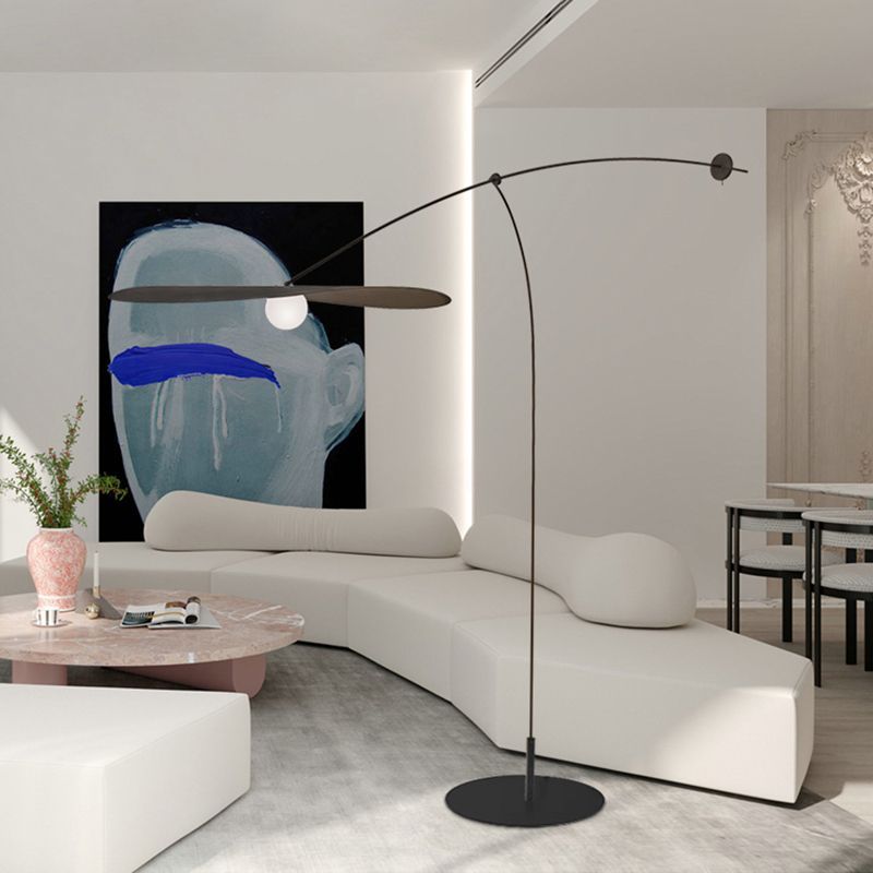 Carins Modern Bowl Floor Lamp illuminating modern living room