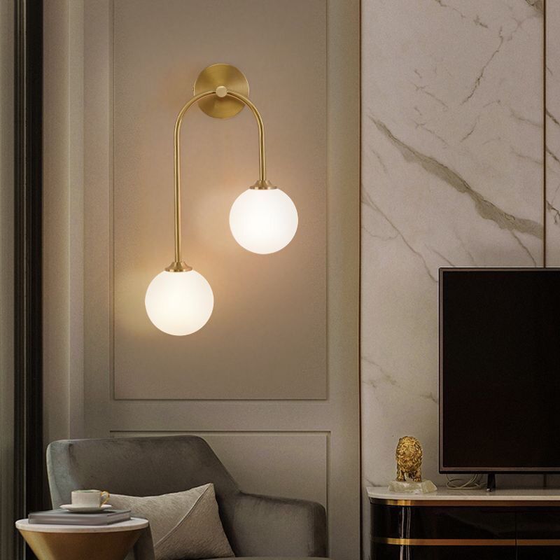 Valentina brass wall lamp with globe, living room lighting
