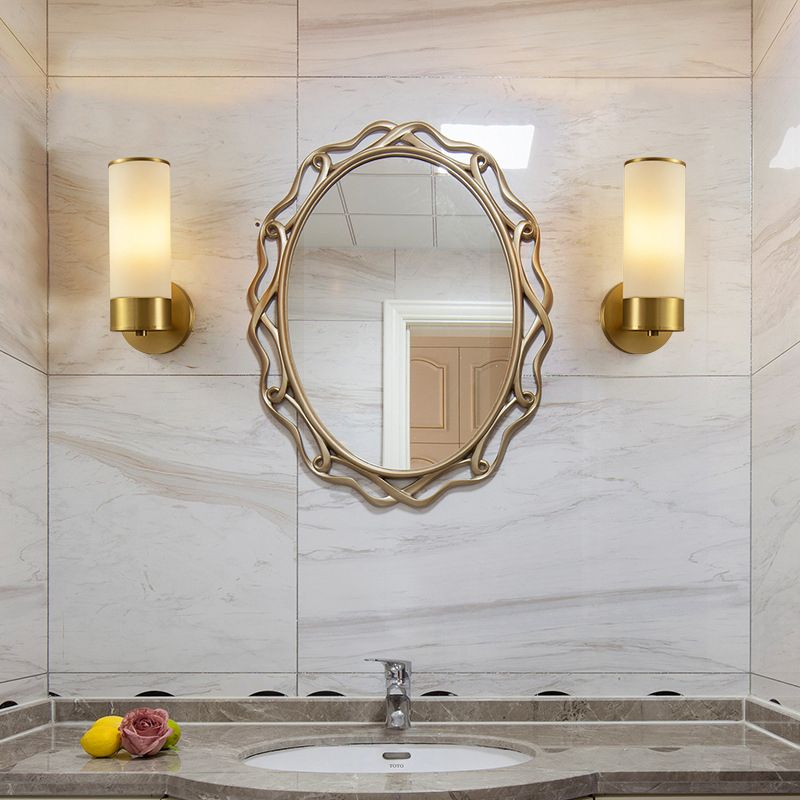 Leigh brass wall lamp in bathroom setting