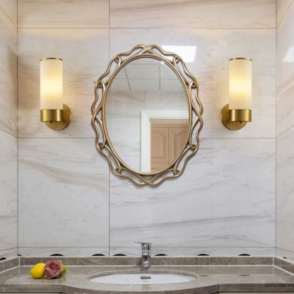 Leigh brass wall lamp in bathroom setting