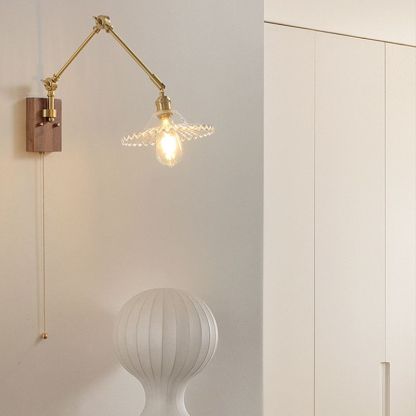 Ozawa adjustable metal wall lamp with glass shade.