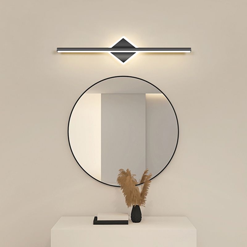 Leigh LED vanity light above round mirror in bathroom.