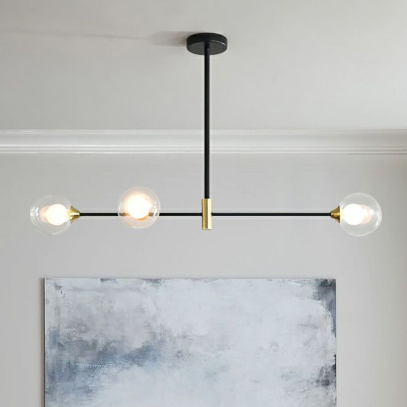 Modern three-light pendant with glass globe shades