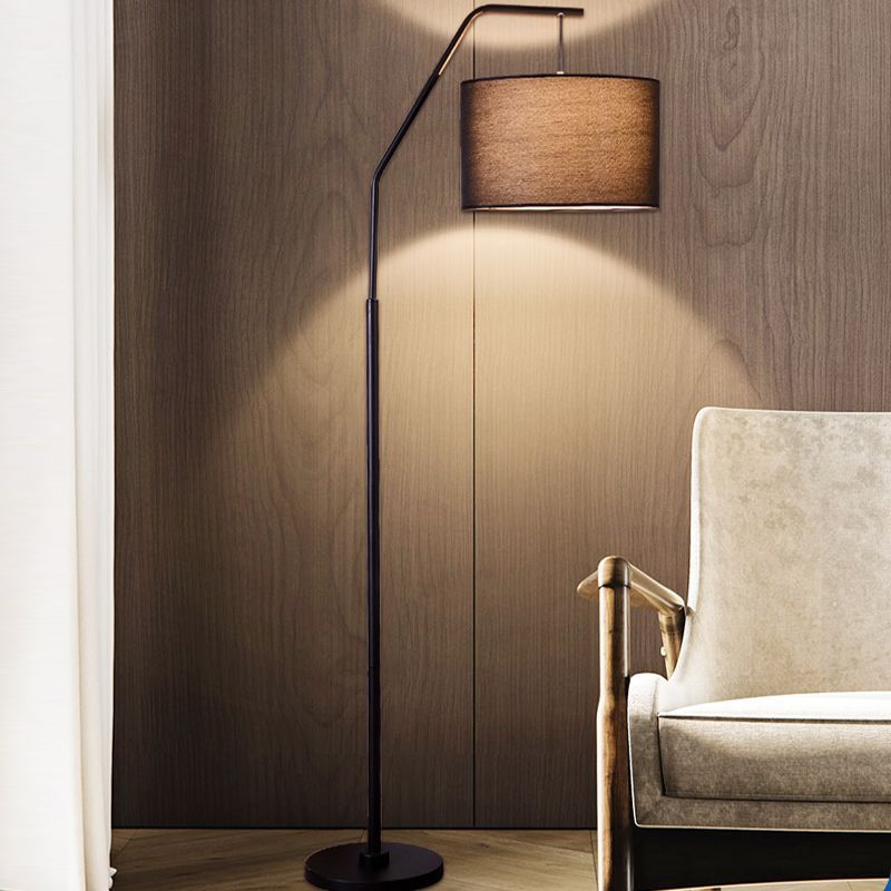 Eryn cylinder floor lamp with black metal frame and fabric shade.