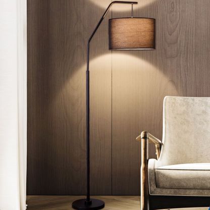Eryn cylinder floor lamp with black metal frame and fabric shade.