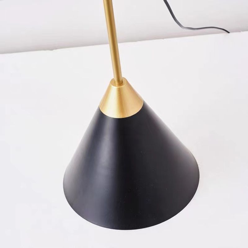 Modern Salgado floor lamp, cone-shaped black shade with gold accent