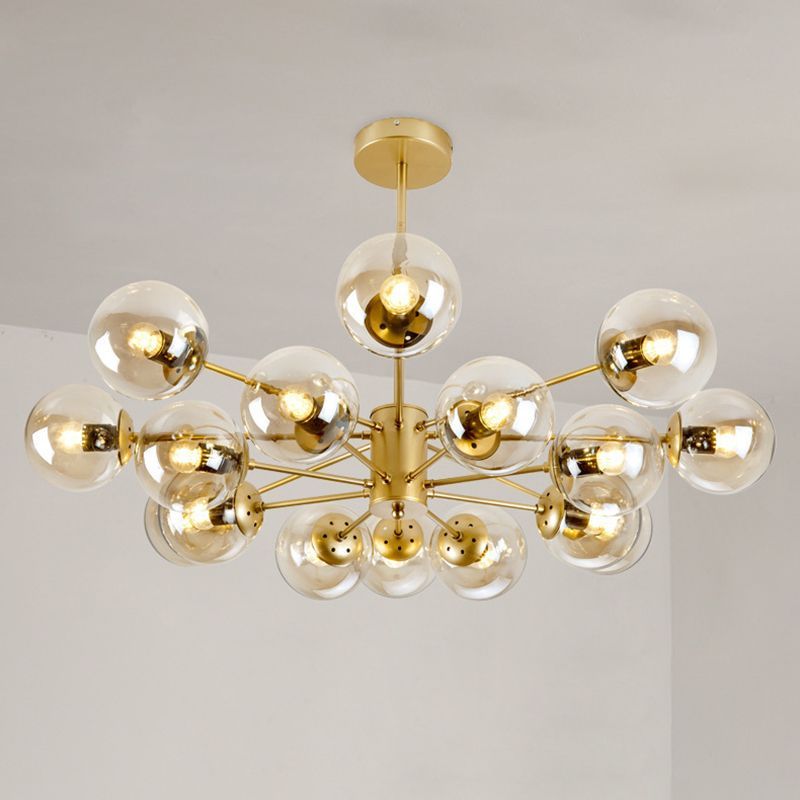Gold Sputnik pendant light with glass globe shades.