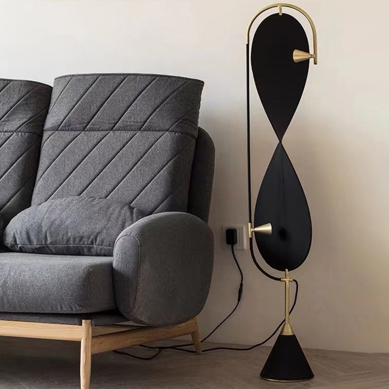 Black and Gold Geometric Floor Lamp beside grey sofa
