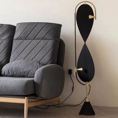 Black and Gold Geometric Floor Lamp beside grey sofa