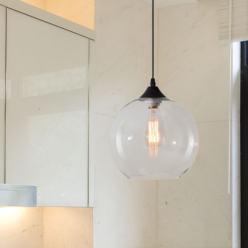 Clear glass globe pendant light in kitchen