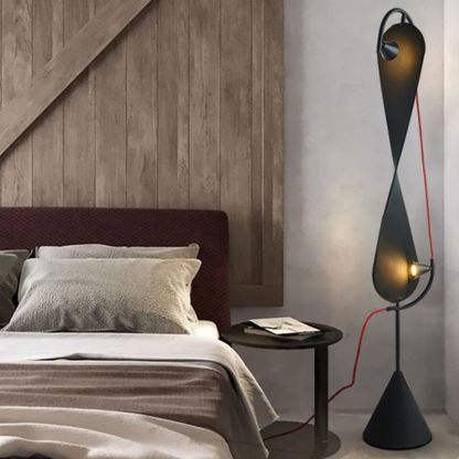 Salgado Geometric Metal Floor Lamp beside a bed