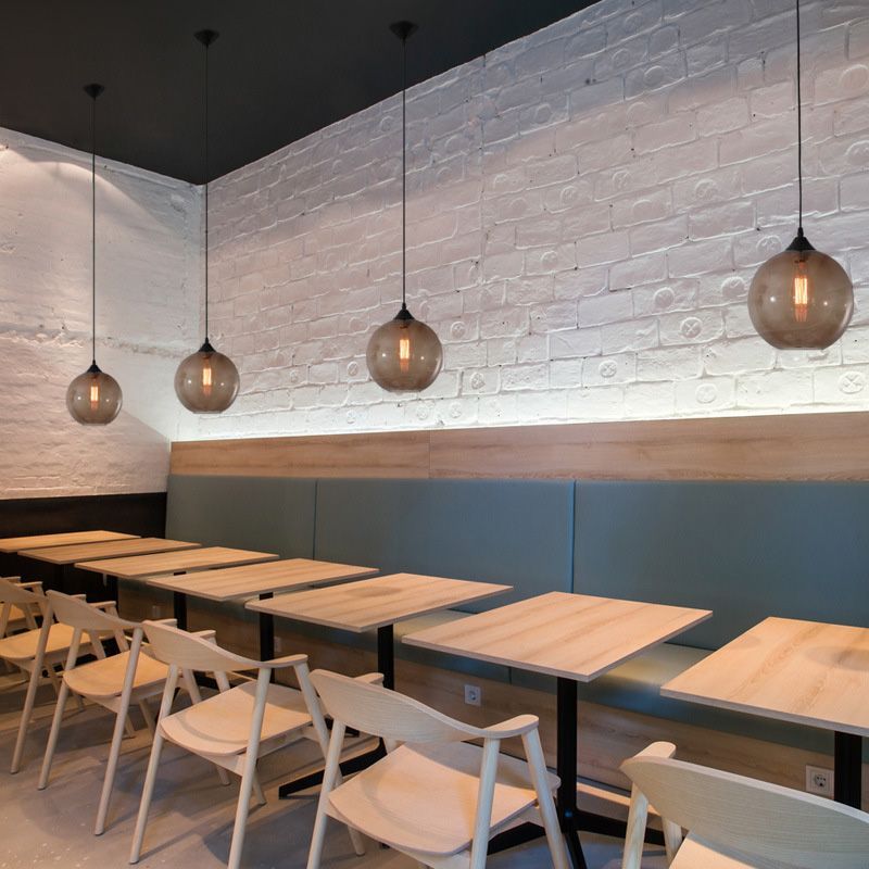 Hailie brown glass globe pendant lights in a restaurant setting