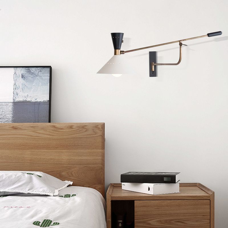 Carins Wall Lamp installed in bedroom with adjustable arm