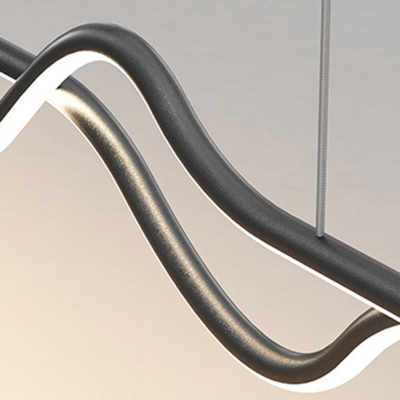 Modern black metal pendant light, curved design.