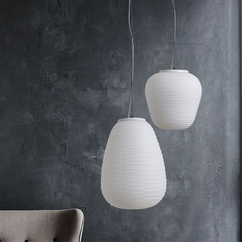 White Renée pendant lights, Lassola, pebble design, indoor lighting.