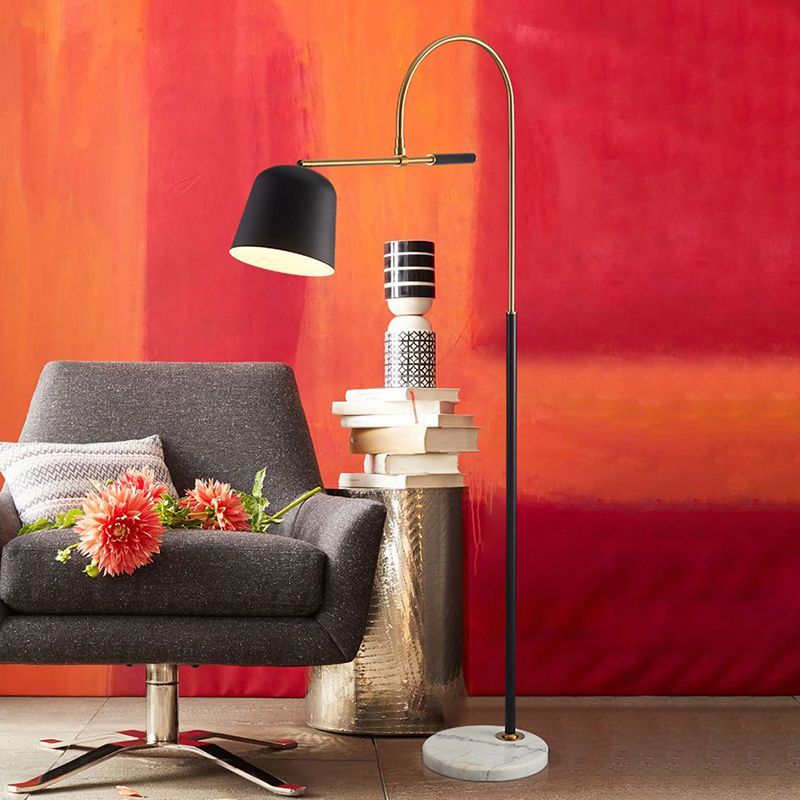Modern arc floor lamp beside armchair in living room