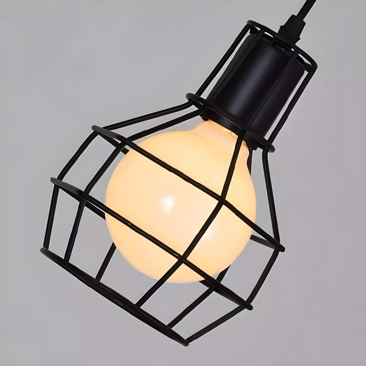 Black caged Alessio pendant light, industrial style.