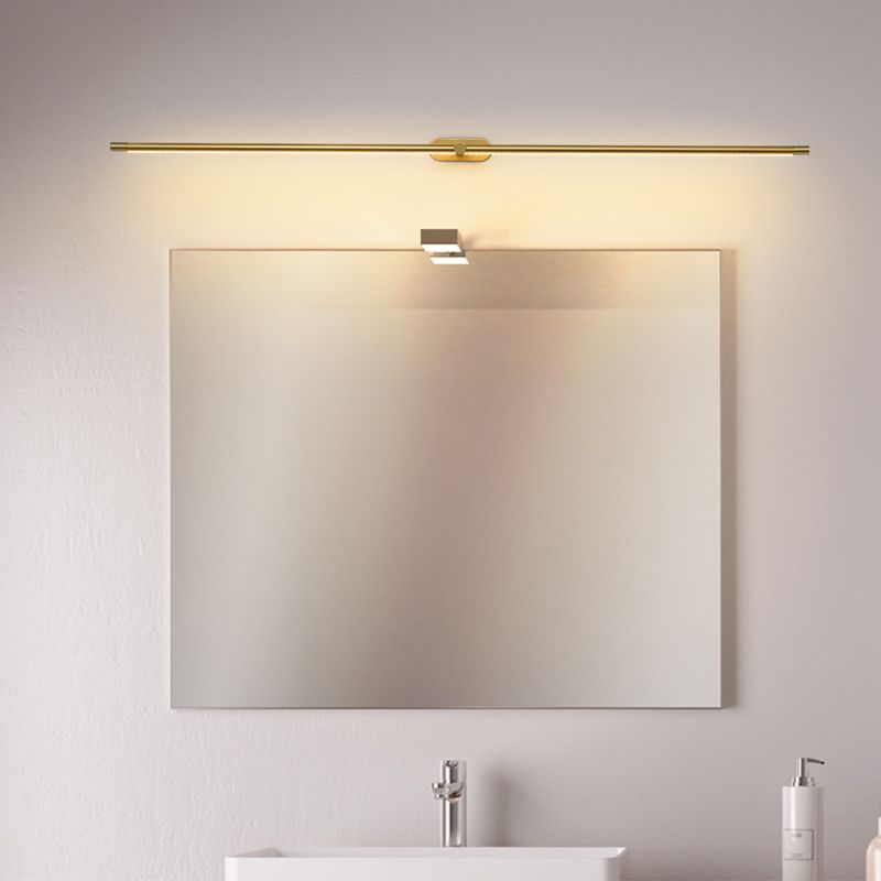 Gold Leigh minimalist wall lamp above mirror. Modern lighting.