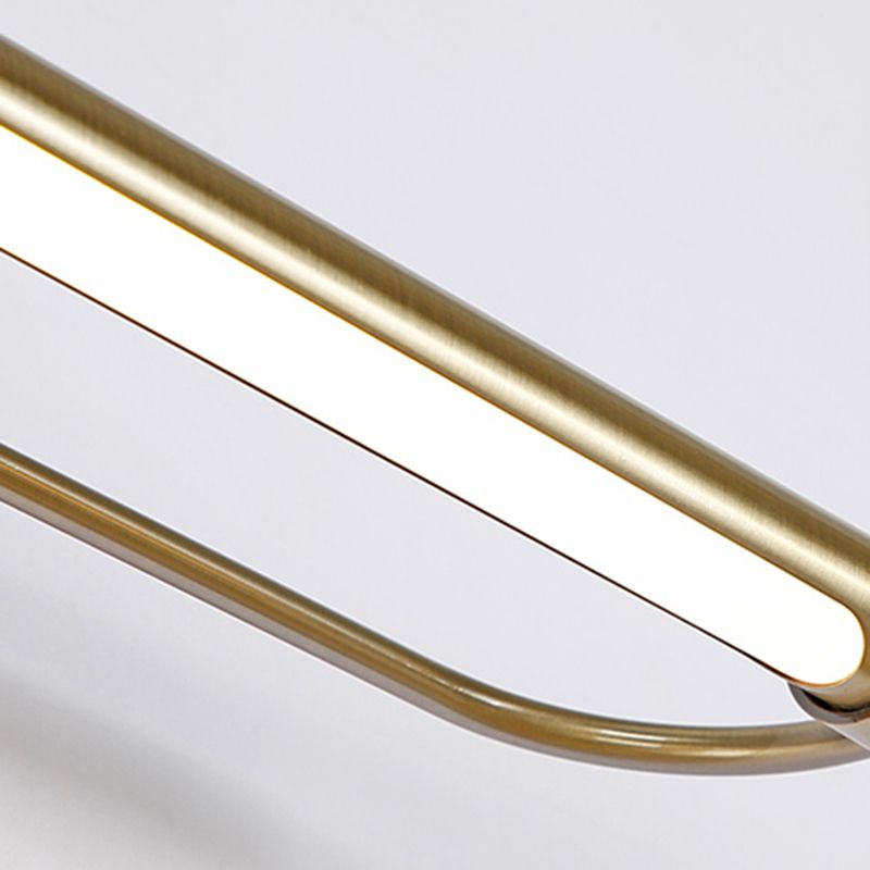 Close-up of Leigh gold metal bathroom vanity light.