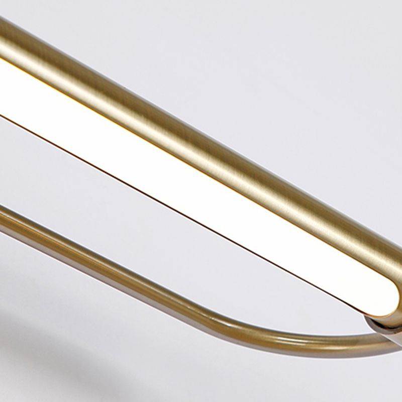 Close-up of Leigh gold metal bathroom vanity light.