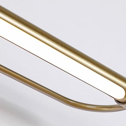 Close-up of Leigh gold metal bathroom vanity light.