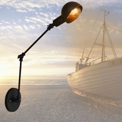 Brady Black Metal Adjustable Wall Lamp on beach