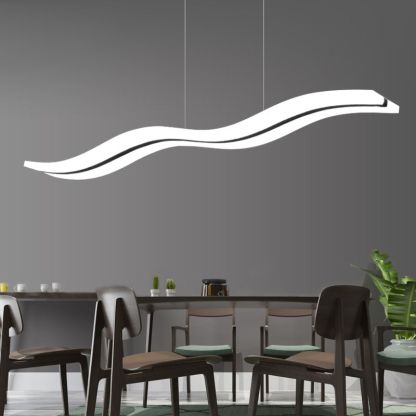 Minimalist wave pendant light in dining room by Las Sola