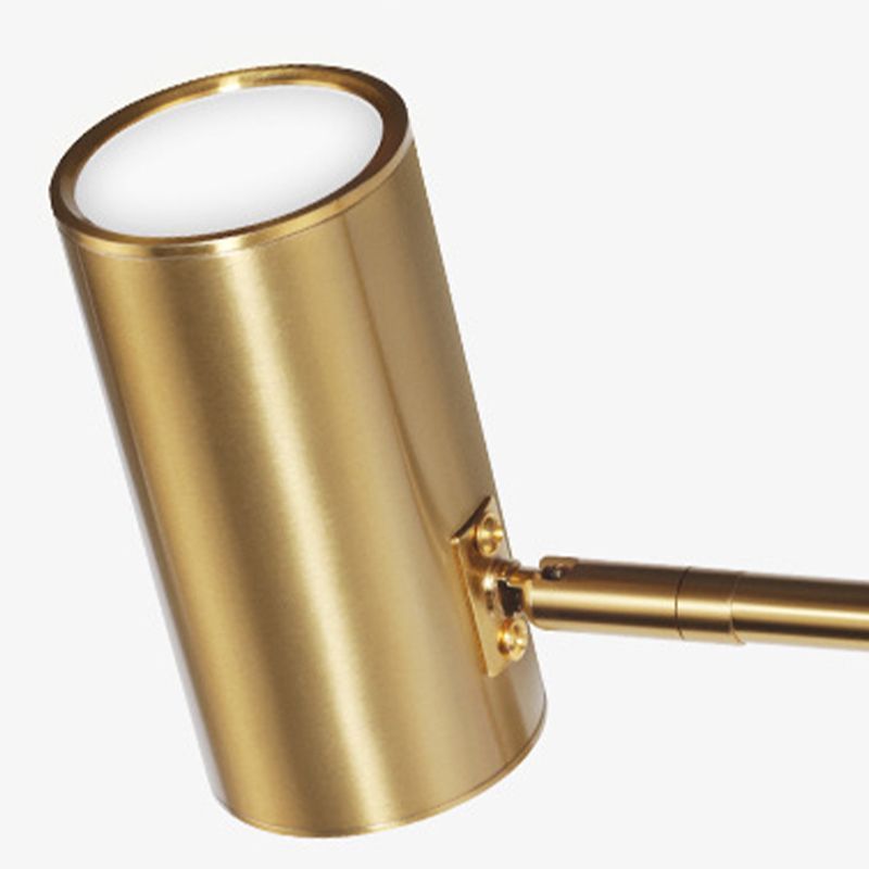 Freja brass wall lamp, cylindrical bedroom lighting