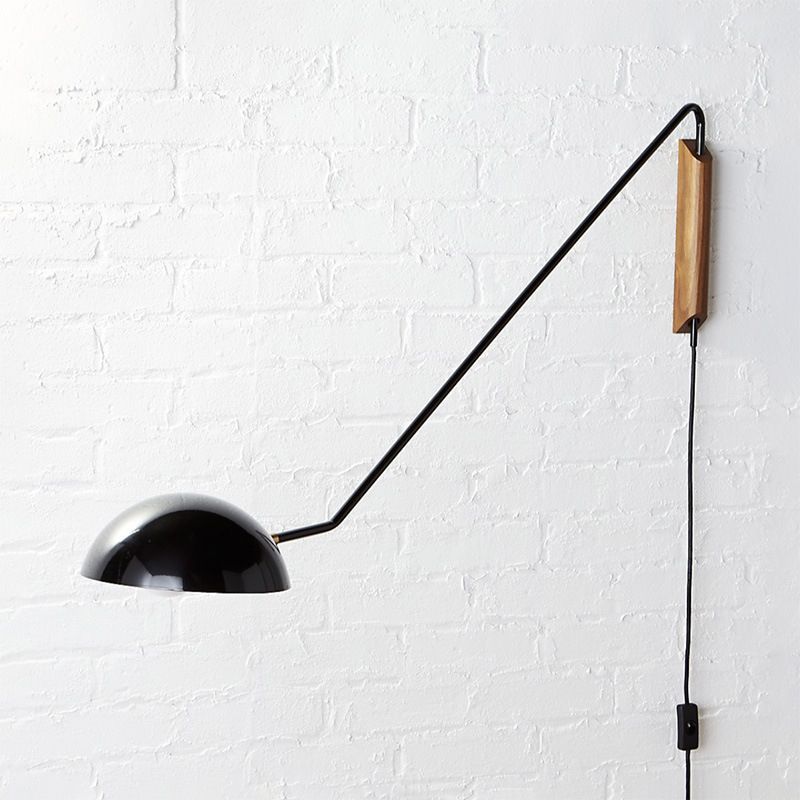 Black Brady Wall Lamp on White Brick Wall