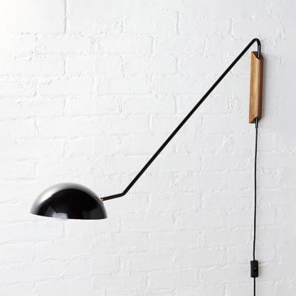 Black Brady Wall Lamp on White Brick Wall
