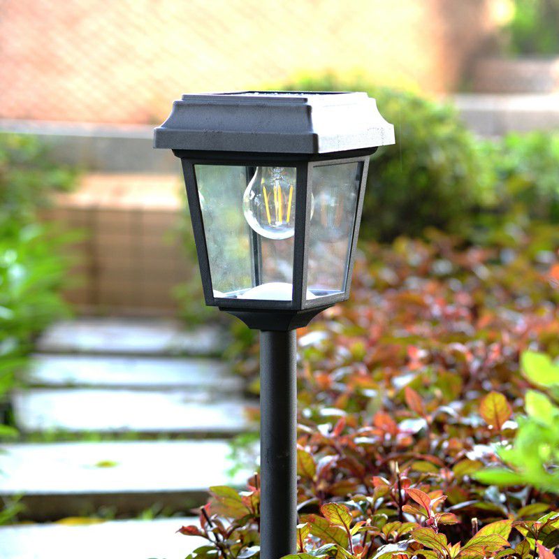 Vintage solar bollard light in garden