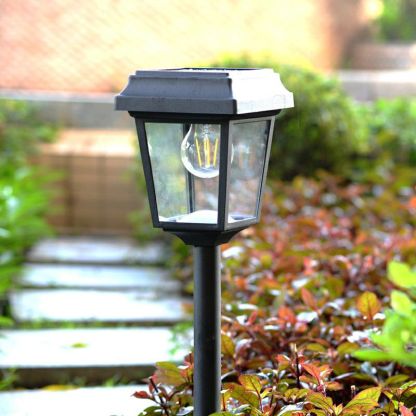Vintage solar bollard light in garden