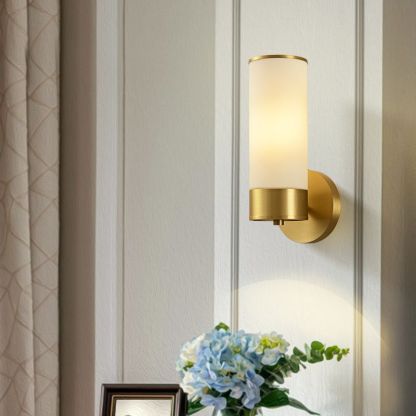 Leigh brass wall lamp with glass shade and floral decoration