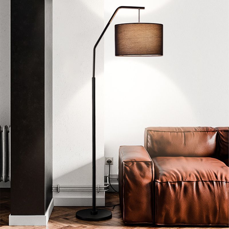 Eryn cylinder floor lamp with fabric shade and metal frame.