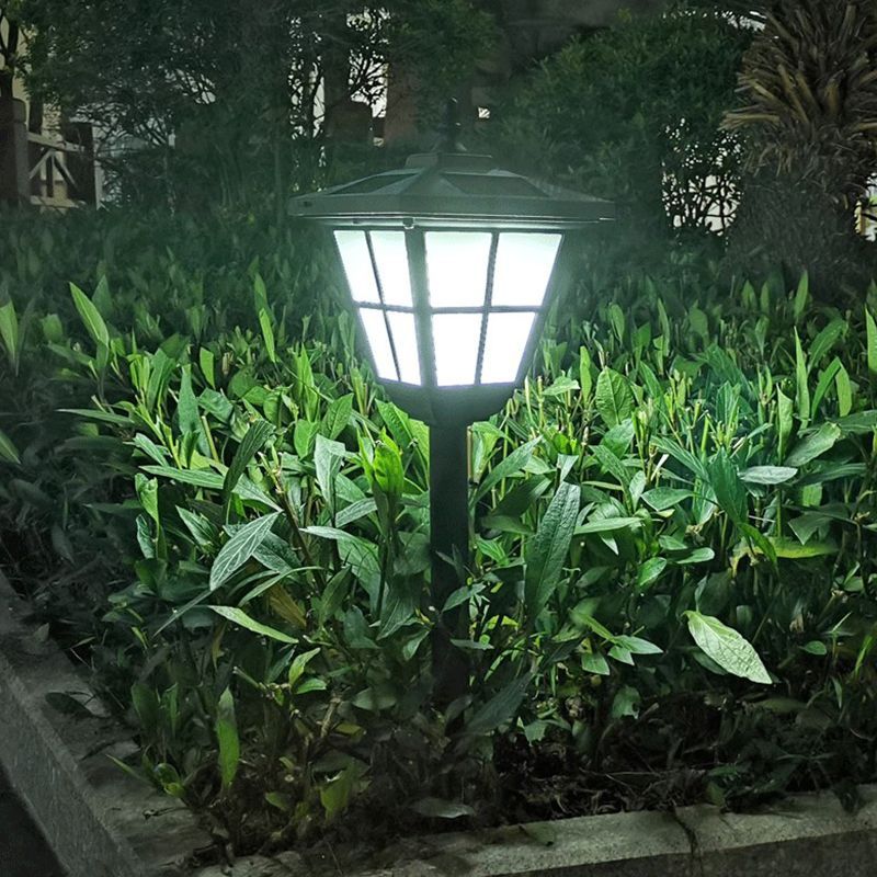 Pena Solar Bollard Light illuminating a garden at night