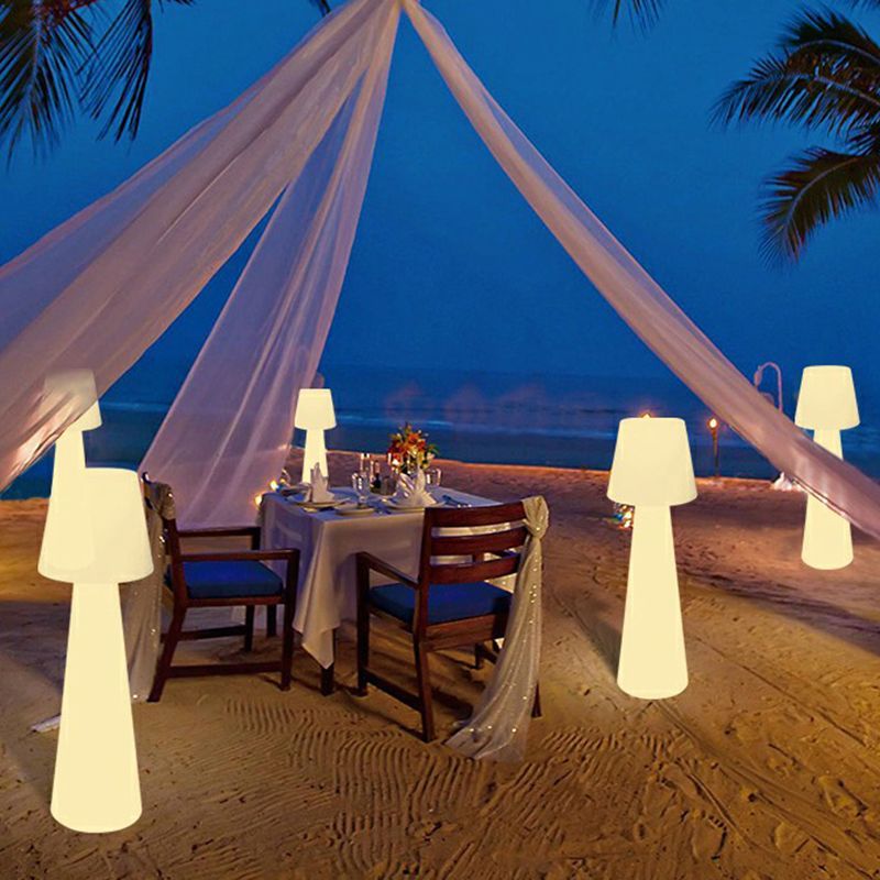 Pena Outdoor Path Lights creating romantic beach dining atmosphere