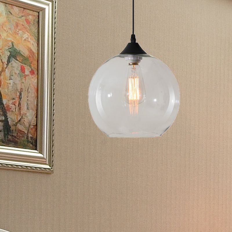 Clear glass globe pendant light with visible bulb