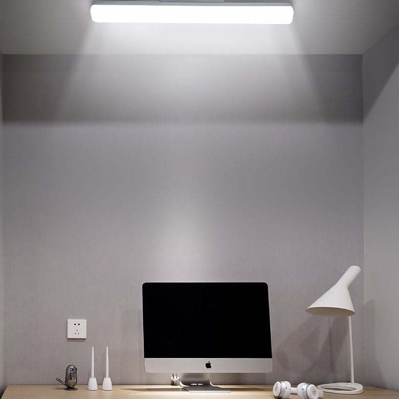 Edge Modern Wall Lamp illuminating workspace