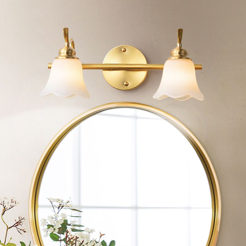 Félicie Gold Flower Wall Lamp over Mirror